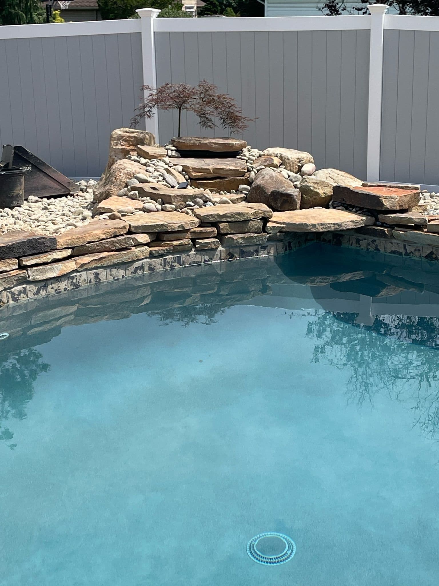 Poolside Elegance with Natural Rock Water Feature image