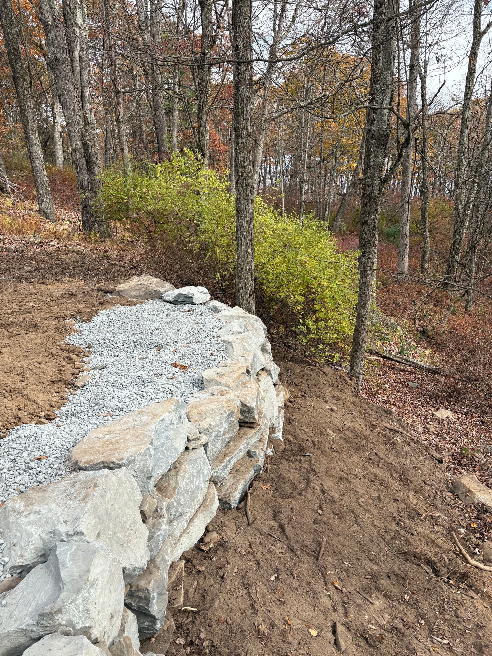 Natural Boulder Wall Enhances Outdoor Spaces image